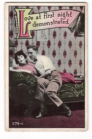 Comic postcard depicting a romantic couple on a divan, "Love at first sight demonstrated", c. 1910s