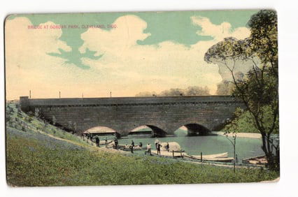 Postcard showing the stone arch bridge and boaters on the shore at Gordan Park, Cleveland, Ohio,