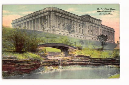 Postcard view of The New Court House from the lake with footbridge over waterway, Cleveland, OH