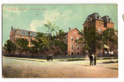 Postcard featuring an exterior view of Charity Hospital on a street corner in Cleveland, Ohio c.1910