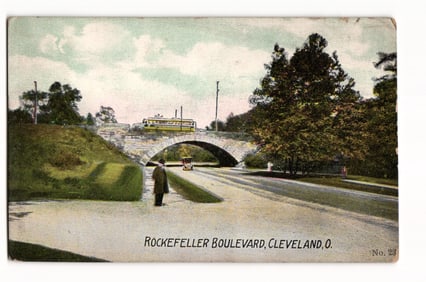 Postcard showing the stone bridge and a passing streetcar on Rockefeller Boulevard, Cleveland, Ohio