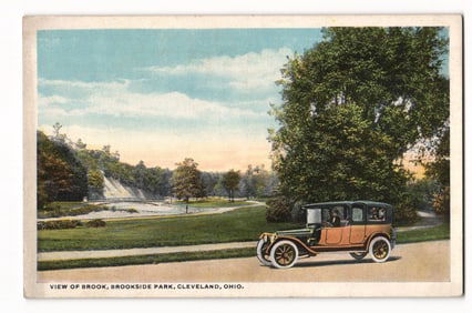 Postcard showing a scenic view of Brookside Park in Cleveland, Ohio with an early automobile c.