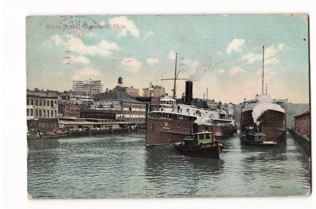 Postcard showing Great Lakes freighters and tugboats docked on the Cuyahoga River, Cleveland, Ohio (1 of 2)