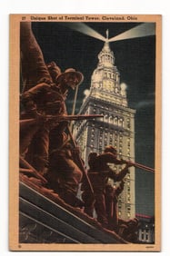 Postcard night view of Cleveland, Ohio's Terminal Tower with Soldiers' and Sailors' Monument, c.