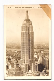 Sepia postcard showing the iconic 102-story Empire State Building in New York City, WWII era view.