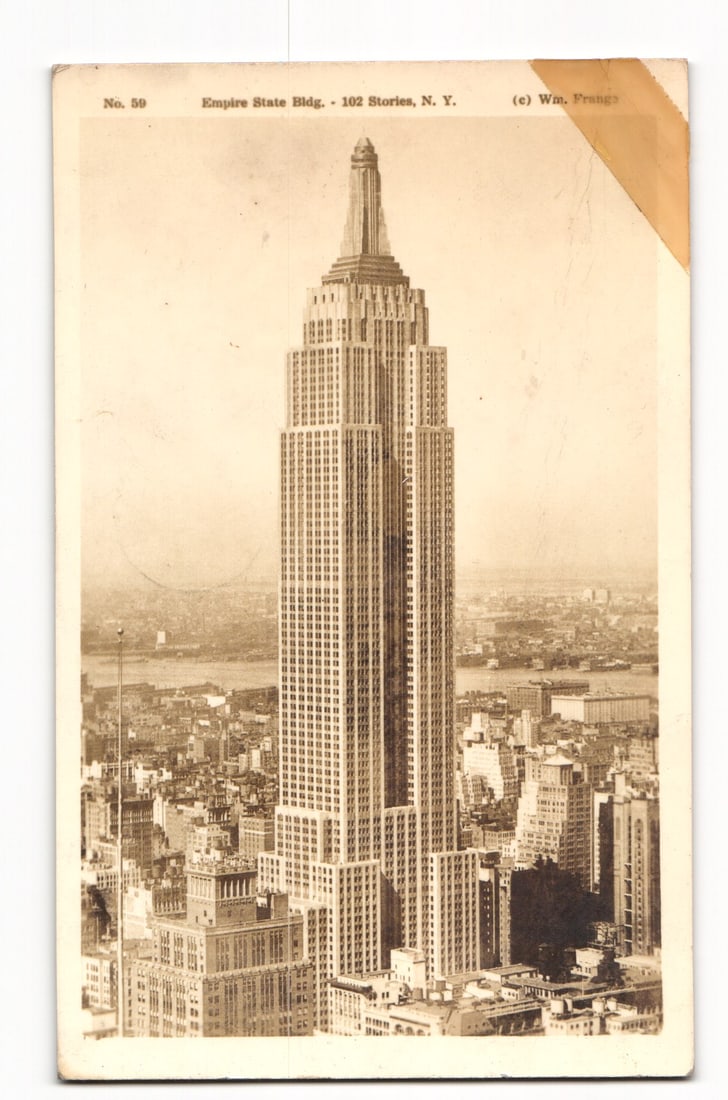 Sepia postcard showing the iconic 102-story Empire State Building in New York City, WWII era view. (1 of 2)
