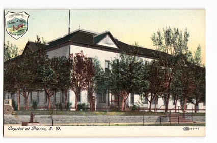 Postcard showing the old State Capitol building surrounded by trees in Pierre, South Dakota, c.