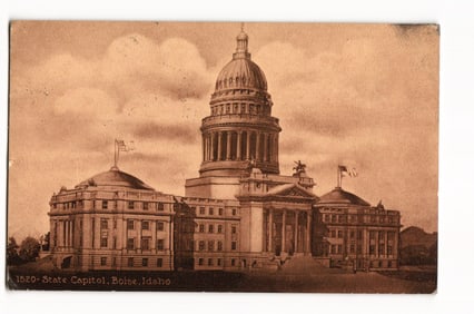 Postcard featuring a grand architectural view of the Idaho State Capitol building in Boise c. 1912.