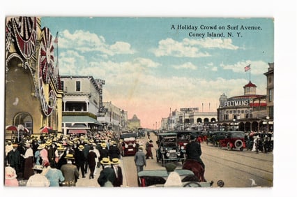 Postcard view of a holiday crowd on Surf Avenue, Coney Island, NY showing Feltmans and cars c. 1918