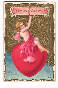 Embossed Valentine postcard of a cupid-like child sitting on a large red heart, gilded background.