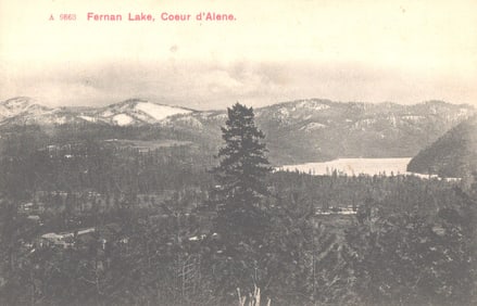 Postcard showing a scenic landscape of Fernan Lake and snow-dusted mountains, Coeur d'Alene, Idaho.