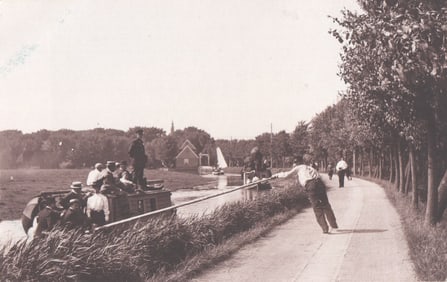 RPPC Real Photo Postcard showing a man pulling a canal boat along a towpath near Edam, Netherlands