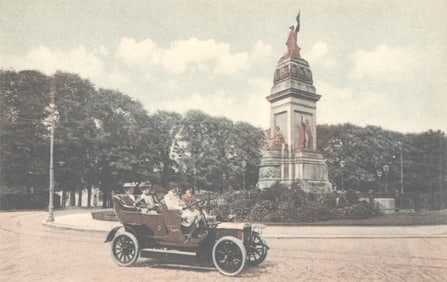 Postcard showing an early motorcar driving past the National Monument in The Hague, Netherlands