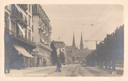 Postcard showing the Schweizerhofquai in Luzern, Switzerland, with a streetcar and pedestrians c.