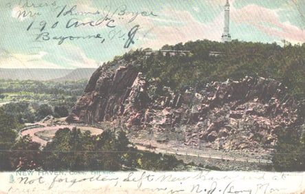 Raphael Tuck & Sons postcard showing the road at the base of East Rock and the monument, New Haven,