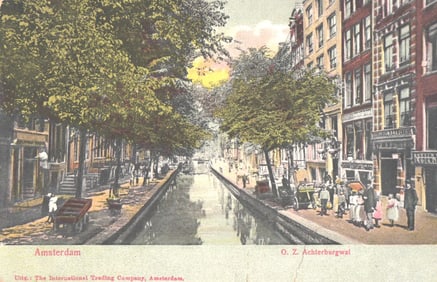 Postcard of Amsterdam, Netherlands showing a bustling scene on the O. Z. Achterburgwal canal c.1910.