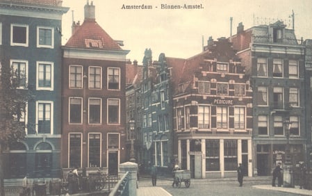Postcard showing a street scene on the Binnen-Amstel in Amsterdam with classic canal houses c. 1911.
