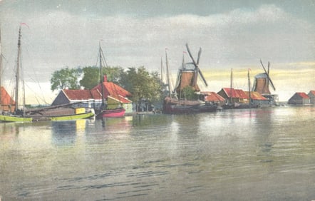 Photochrome postcard of a Dutch waterfront village with classic windmills and sailing boats, c.