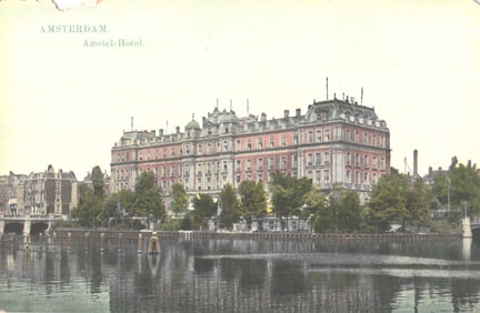 Postcard showing the grand Amstel-Hotel in Amsterdam, Netherlands viewed from across the river c.