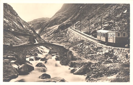 Postcard showing the Gornergrat-Bahn railway train crossing a stone bridge in the Swiss Alps, circa