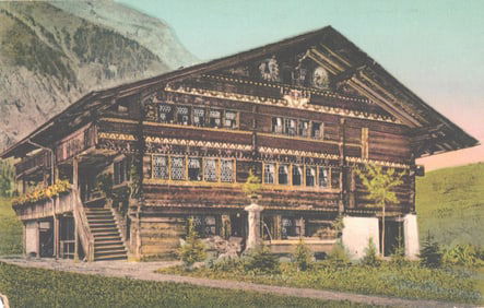 Postcard of an intricately carved wooden chalet in the Swiss Alps, an example of folk art, c. 1910.