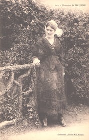 Postcard showing a woman modeling the traditional lace costume from Mauron, Brittany, France c.1910.