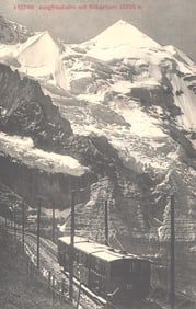 Postcard view of the Jungfraubahn railway train ascending towards the Silberhorn in the Swiss Alps.