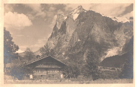 Postcard shows a Grindelwaldnerhaus chalet with the Wetterhorn mountain in Grindelwald, Switzerland