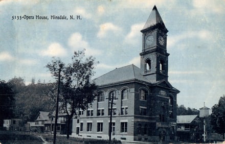 Postcard showing the Opera House with its large clock tower in Hinsdale, New Hampshire, c. 1907.