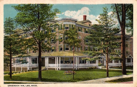 Postcard of the Greenock Inn in Lee, Massachusetts, a large hotel with a wraparound porch c. 1920s.
