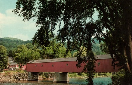 Postcard view of the historic red covered bridge spanning the Housatonic River in West Cornwall, CT.