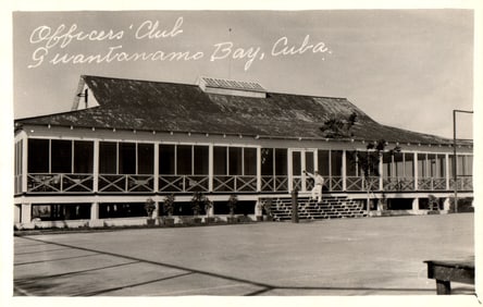 Real Photo Postcard showing the Officers' Club building and tennis courts in Guantanamo Bay, Cuba.