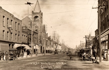 RPPC of 2nd Street North from 5th Avenue in Clinton, Iowa, a bustling street scene circa 1910s.