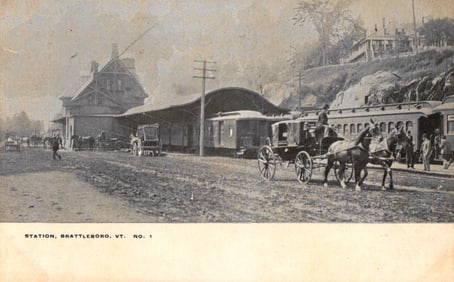 Postcard view of the train station in Brattleboro, Vermont with horse-drawn carriages waiting, circa