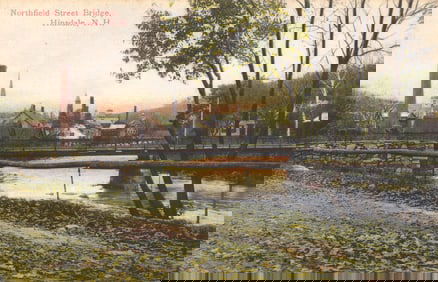 Postcard view of the Northfield Street Bridge spanning the river in the town of Hinsdale, N.H.