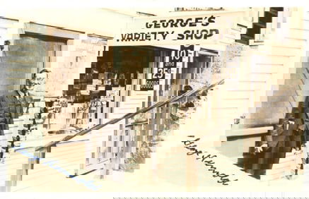 RPPC Real Photo Postcard of owner George Niemold in front of his "George's Variety Shop" circa 1939.