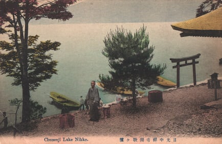 Early 1900s postcard of a serene scene at Chuzenji Lake in Nikko, Japan with a man and boats.