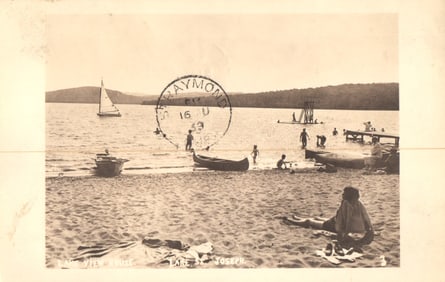 RPPC Real Photo Postcard showing swimmers and boats on the beach at Lake St. Joseph, Quebec, 1930s