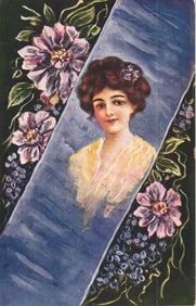 Postcard portrait of an elegant Edwardian woman with flowers in her hair, framed in a blue ribbon.
