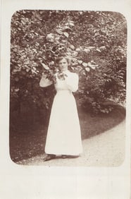 RPPC Real Photo Postcard of an Edwardian woman in a white dress posing by a bush, Pforzheim,