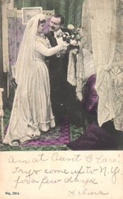 Postcard of an Edwardian wedding scene with a bride presenting a bouquet to her groom, posted 1906.
