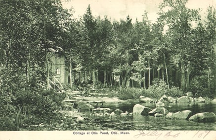 Postcard showing a rustic cottage and rocky shore at Otis Pond in Otis, Massachusetts c. 1909.