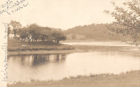 RPPC Real Photo Postcard of a scenic lake view with house in the distance, Jacksonville, VT 1906.