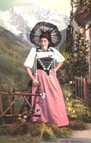 Postcard of a woman in traditional Bernerin (Bernese) Swiss costume with a lace headdress c.1911