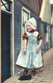 Photochrome postcard of a charming young girl in traditional Dutch folk costume and lace bonnet,