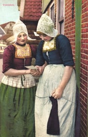 Photochromie postcard of two young women in traditional Dutch folk costumes in Volendam,