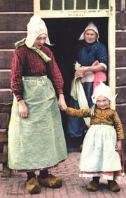 Photochrome postcard of a mother and daughter in traditional Dutch folk costumes in Volendam,