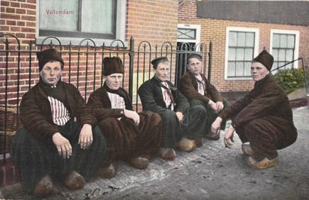 Postcard showing five Dutch men in traditional Volendam folk costume with wooden clogs c. 1908.