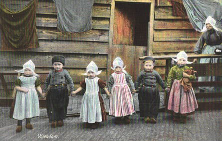 Early 1900s postcard showing children in traditional costumes from the Dutch village of Volendam.
