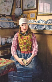 Photochrome postcard of a woman in traditional Marken, Netherlands costume, seated in a Dutch
